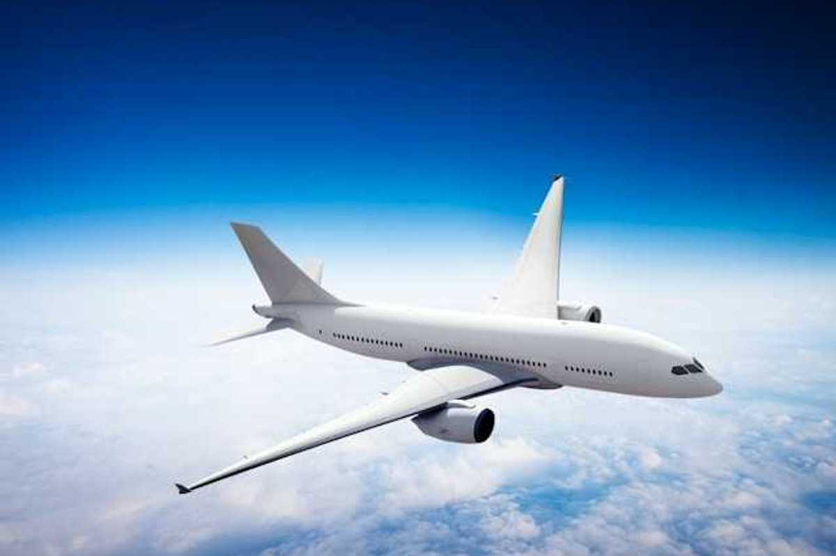 An image of an airplane flying above the clouds
