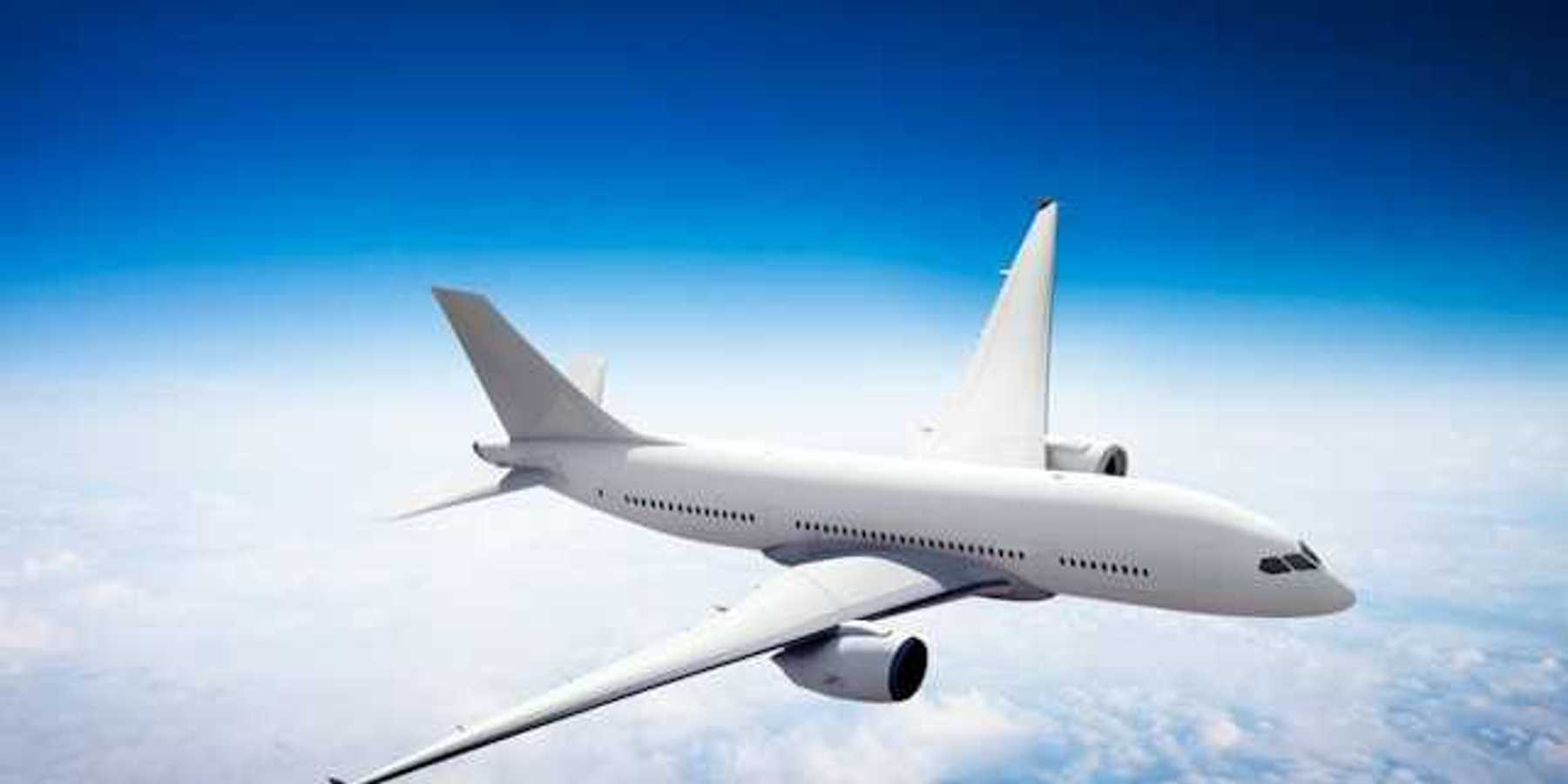 An image of an airplane flying above the clouds
