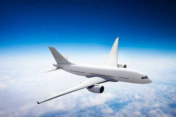 An image of an airplane flying above the clouds