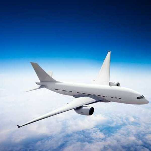 An image of an airplane flying above the clouds