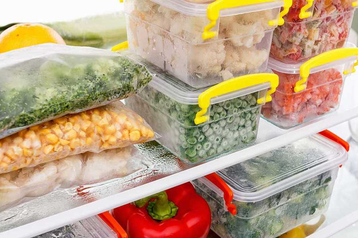 An image of frozen food in tupperware in a freezer