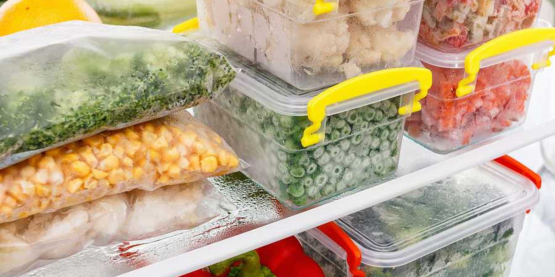 An image of frozen food in tupperware in a freezer