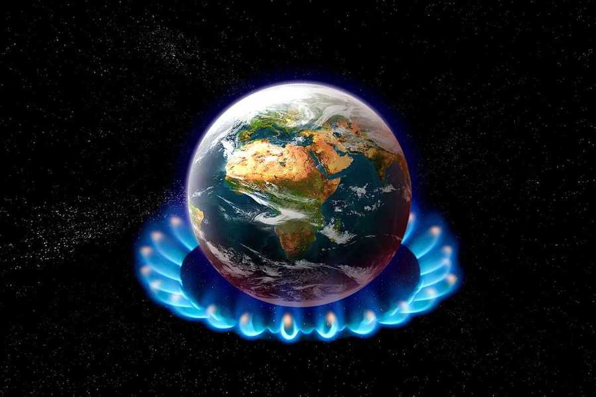 An image of the earth sitting on top of a gas stove burner
