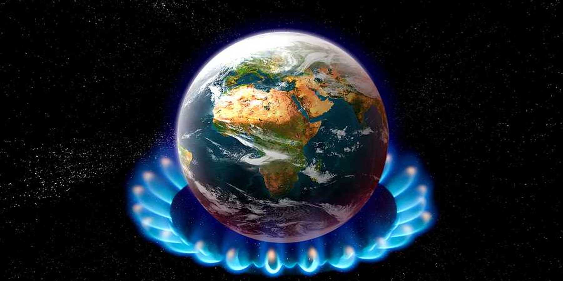 An image of the earth sitting on top of a gas stove burner