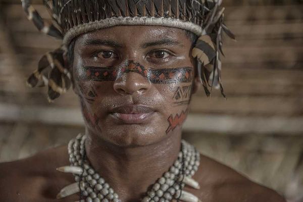 An indigenous Amazon man in native clothing