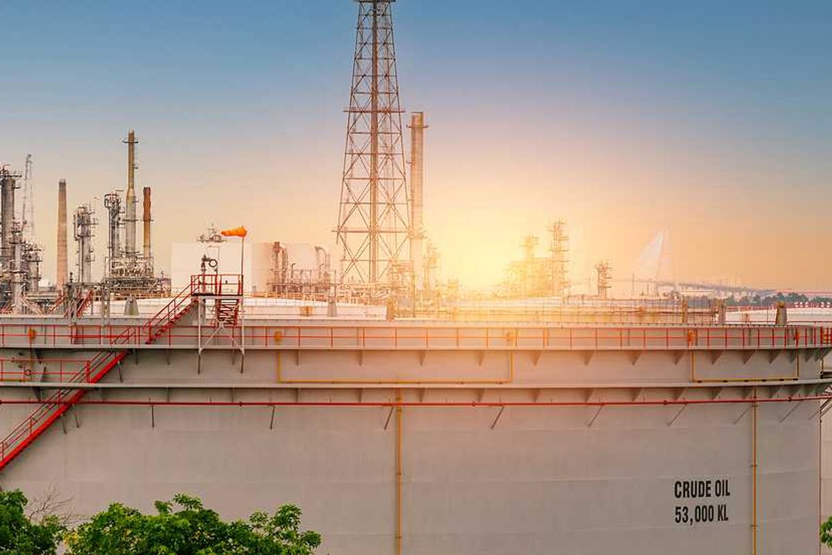 An oil tank with the sunset in the background