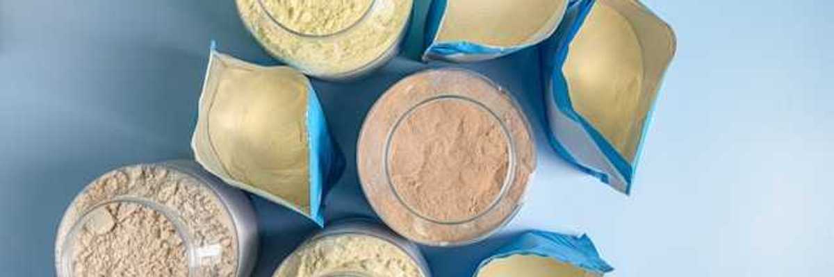 An overhead view of eight protein powder packages