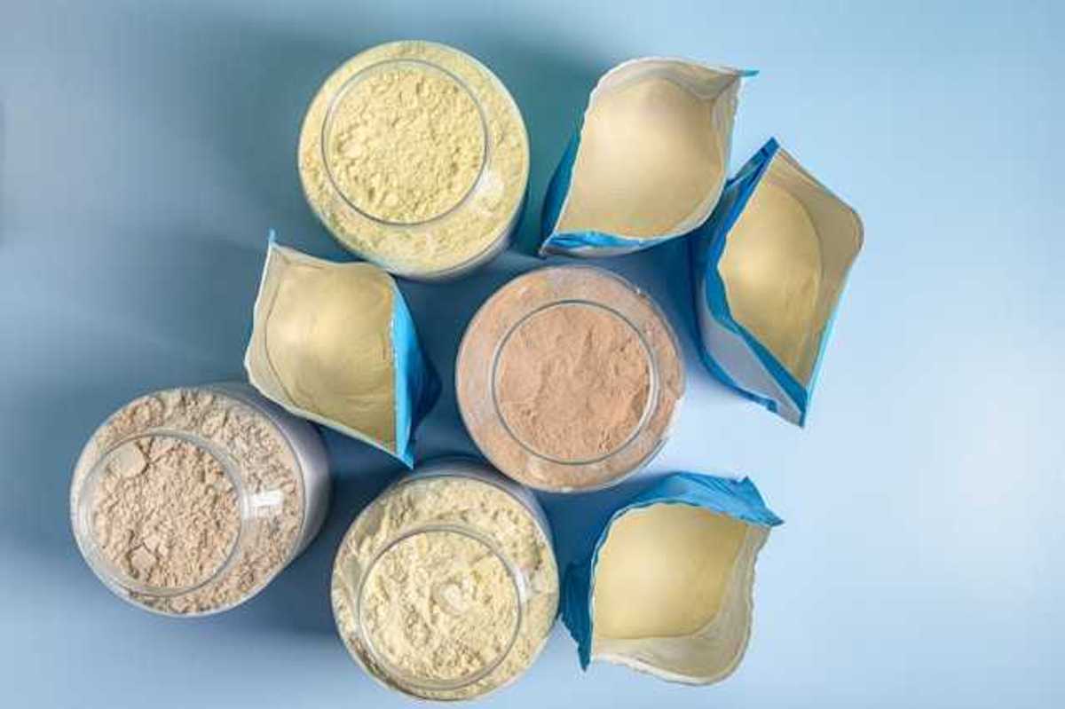 An overhead view of eight protein powder packages