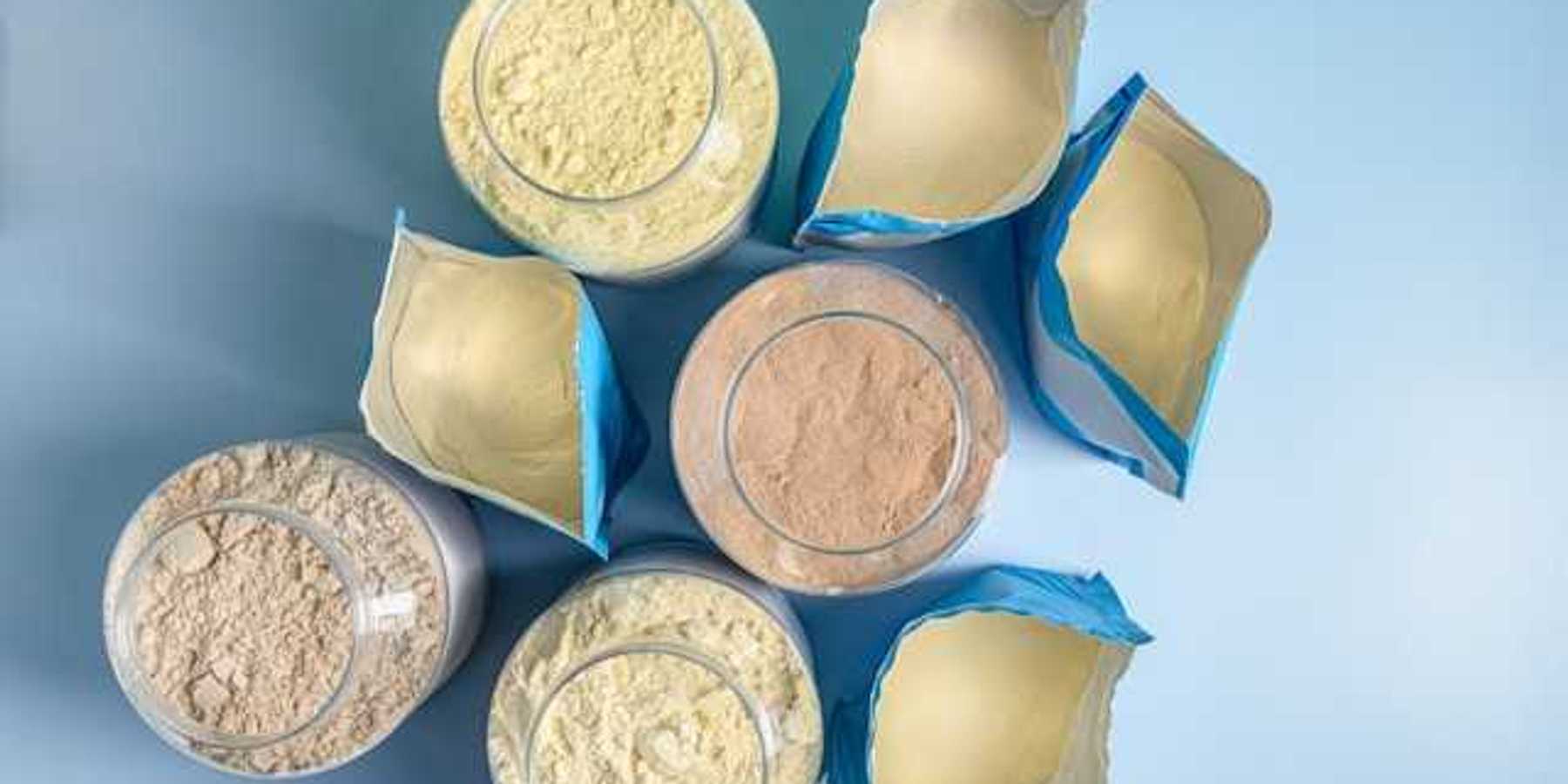 An overhead view of eight protein powder packages