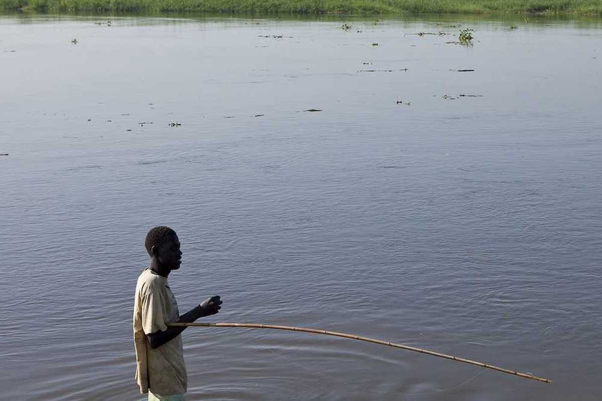 An unidentified man fishes in the White Nile river of South Sudan.