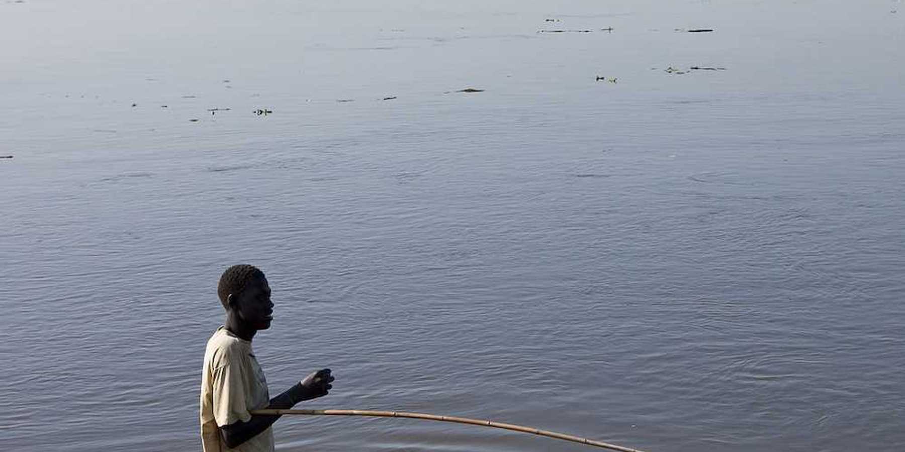 An unidentified man fishes in the White Nile river of South Sudan.