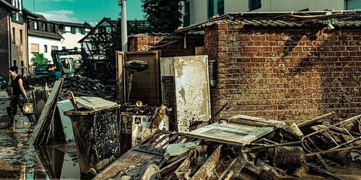 An urban street with debris from a flood.