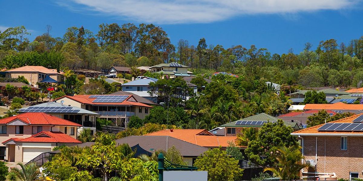 Australian suburban houses with solar panels on roofs