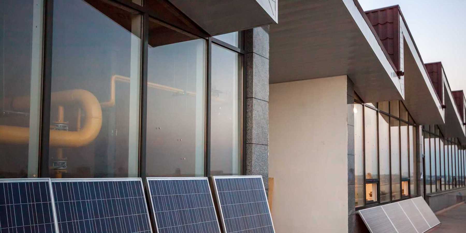 Balcony solar: solar panels on balcony of modern office building