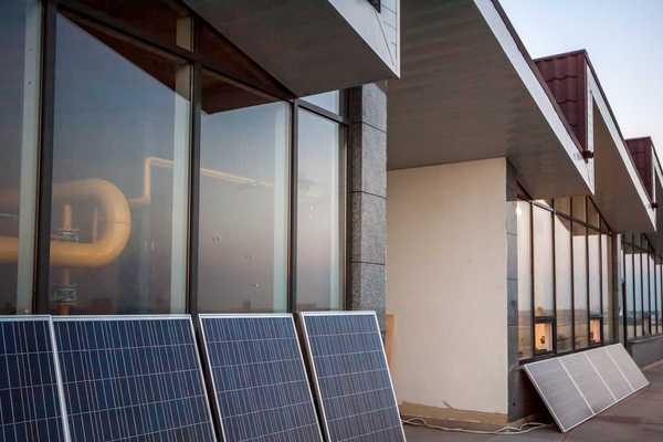 Balcony solar: solar panels on balcony of modern office building
