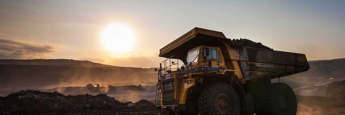 Big yellow mining truck at coal mine work site