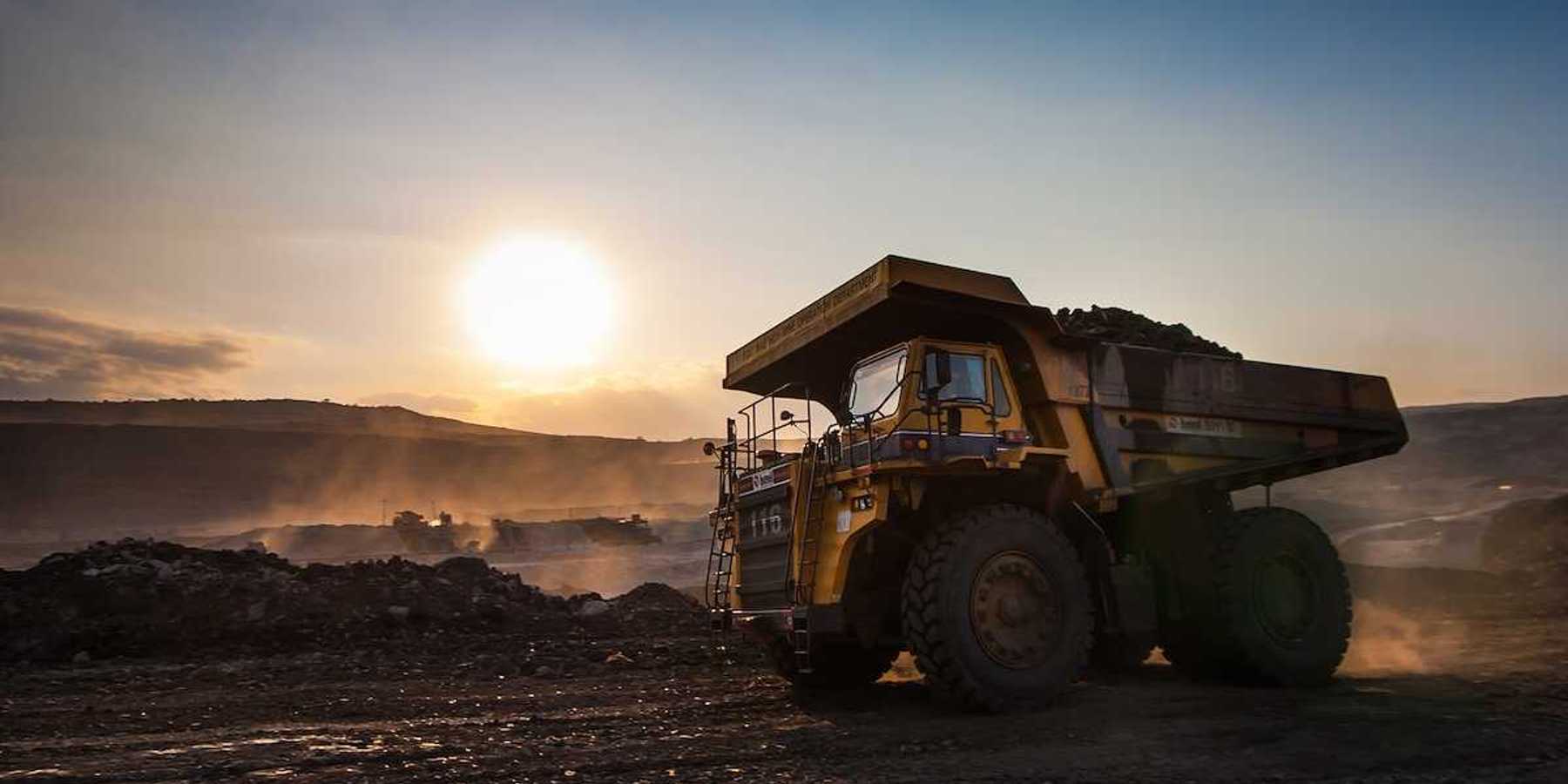 Big yellow mining truck at coal mine work site
