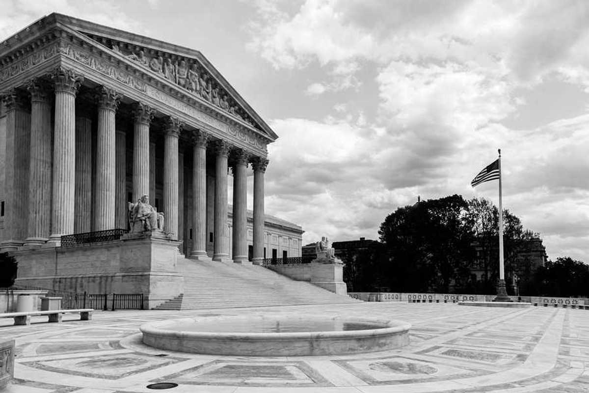 Black and white photo of the Supreme Court of the U.S.