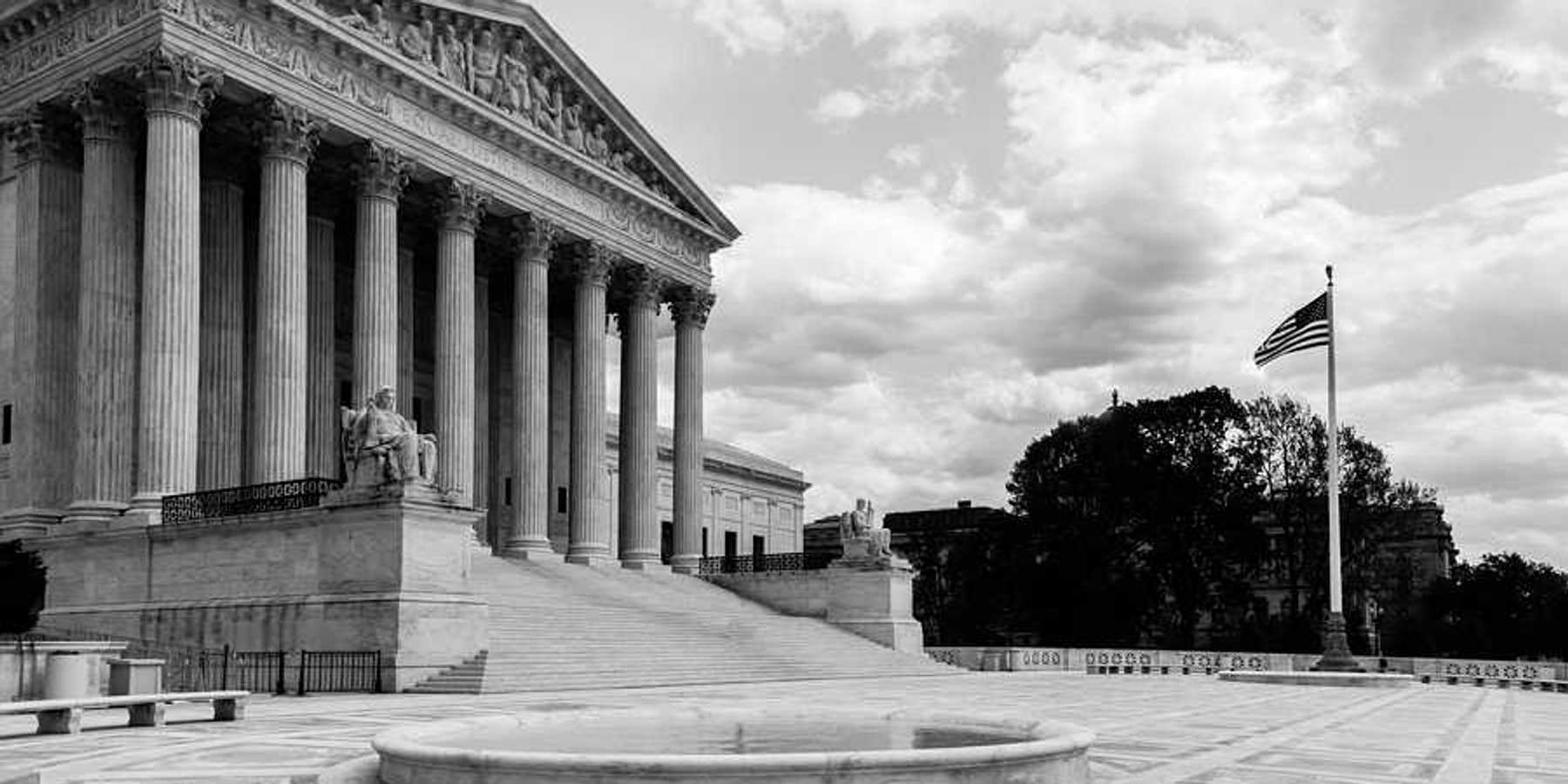 Black and white photo of the Supreme Court of the U.S.