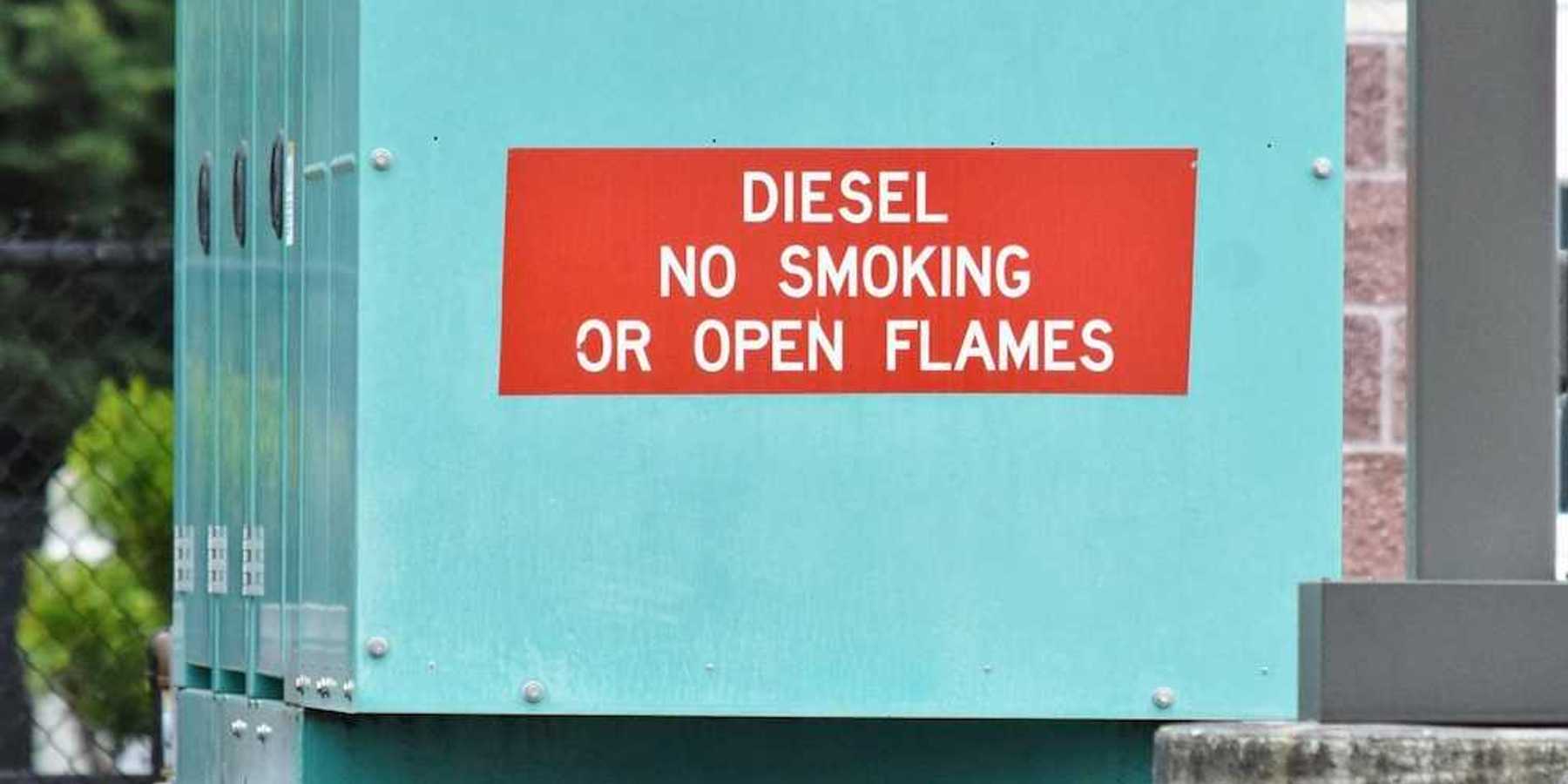 Blue-green diesel generator with signage reading: "DIESEL NO SMOKING OR OPEN FLAMES"