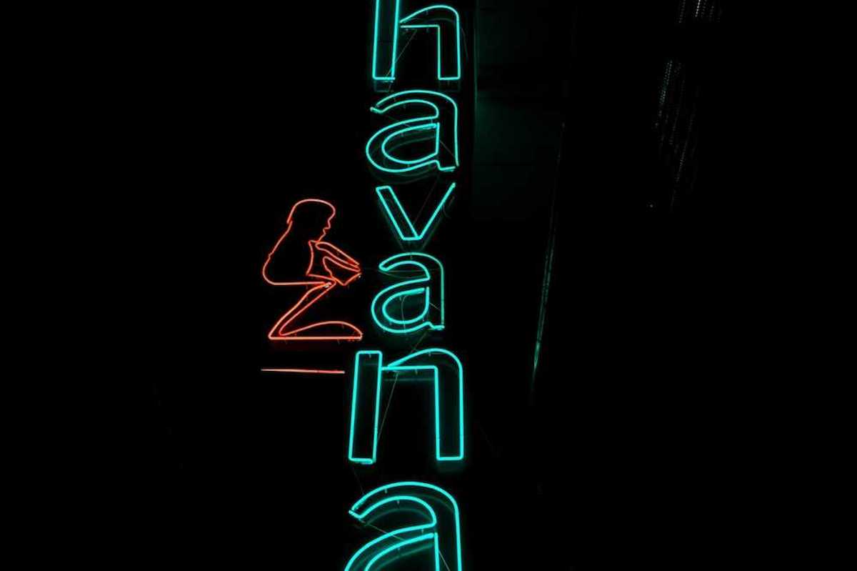 Blue-green neon sign on black background reads "Havana"