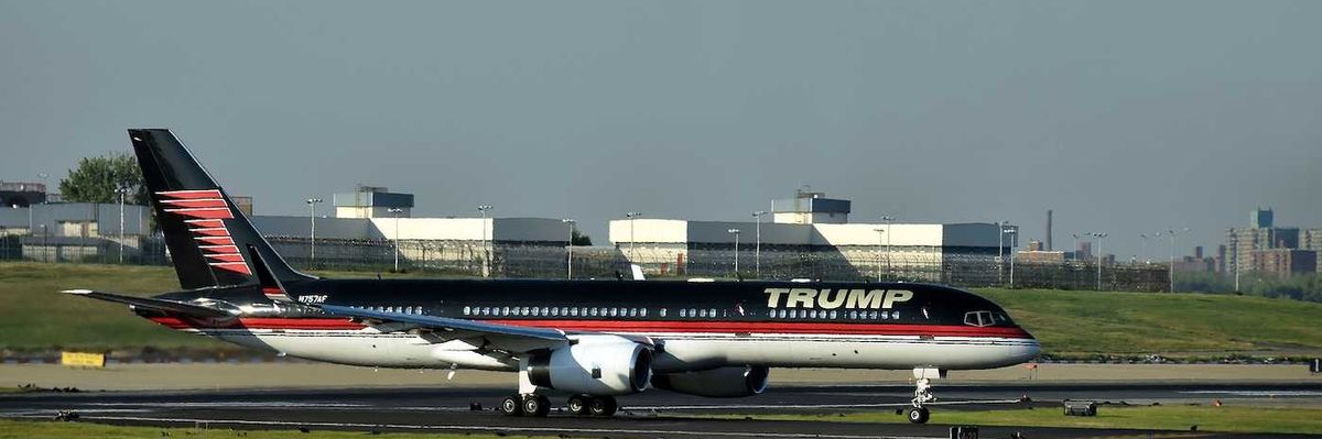 Boeing 757 jet airplane bearing the logo of Donald Trump takes off from Laguardia New York City