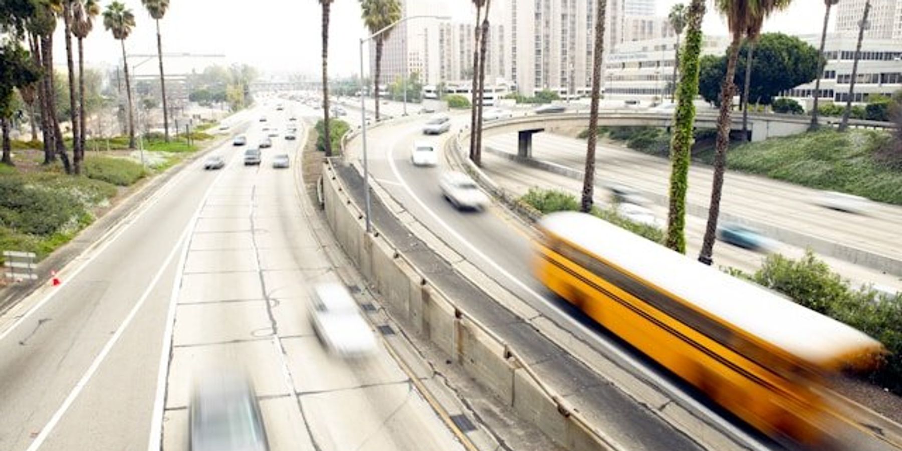 Cars speeding down a California highway.