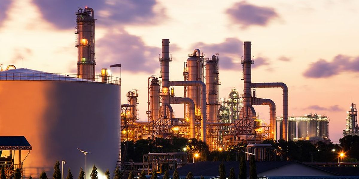 Chemical plants with a sunset in the background.