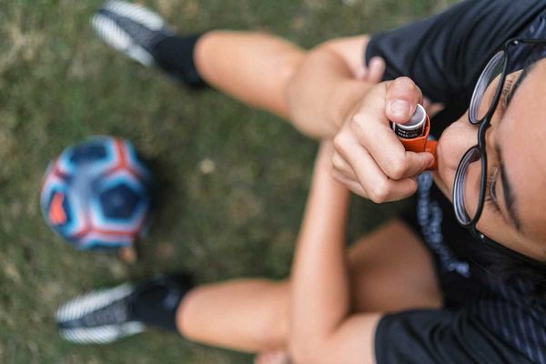 Child with asthma inhaler