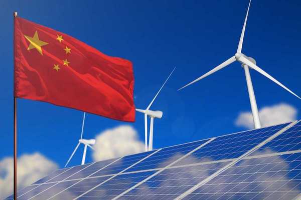 China renewable energy, wind and solar energy concept. Chinese flag superimposed with wind turbines and solar panels