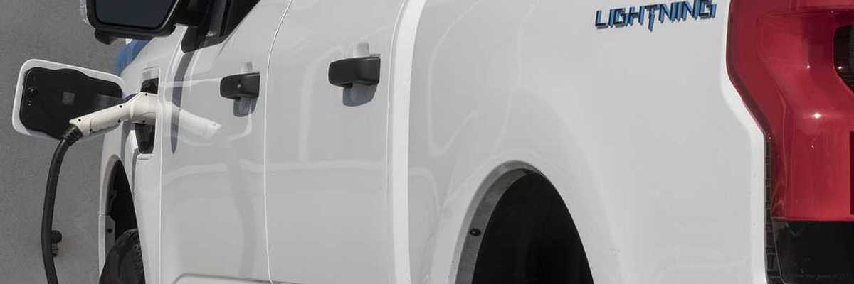 Circa September 2022: Ford F150 Lightning all-electric truck connected to EV charger