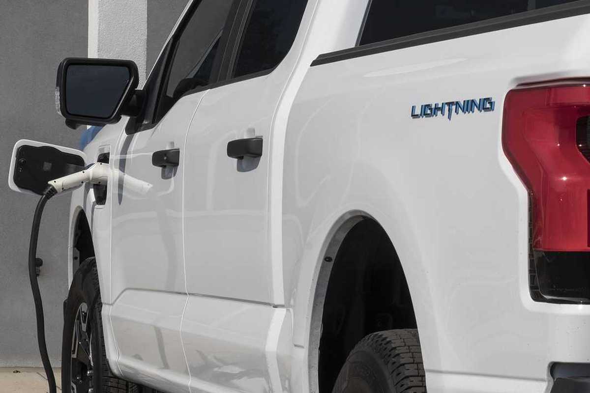 Circa September 2022: Ford F150 Lightning all-electric truck connected to EV charger