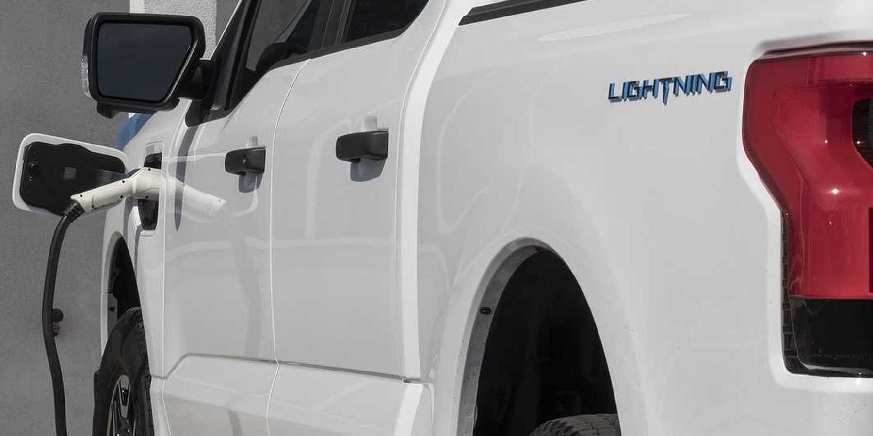 Circa September 2022: Ford F150 Lightning all-electric truck connected to EV charger