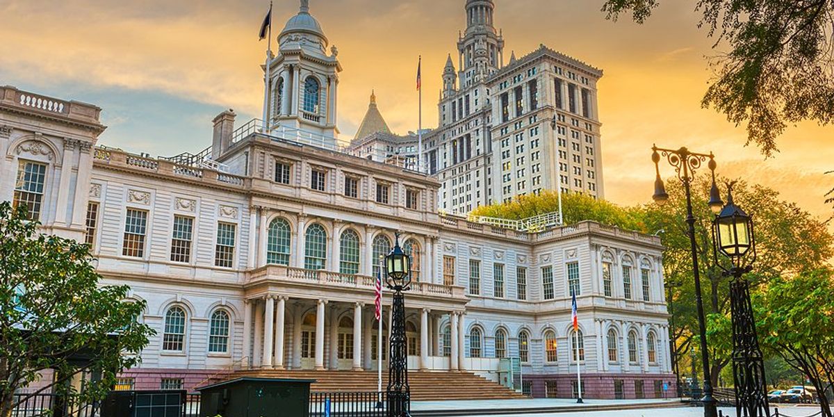 City Hall building in the city of New York with trees on periphery.