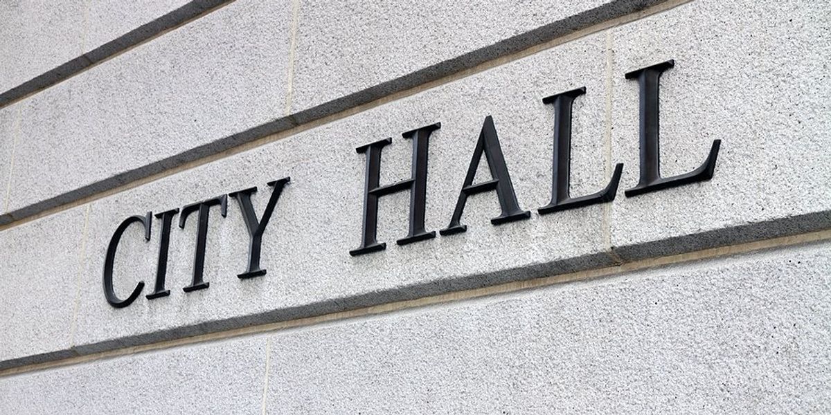 City Hall sign on the side of a building.
