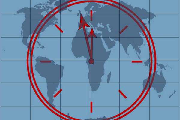 Clock approaching midnight superimposed over a world map