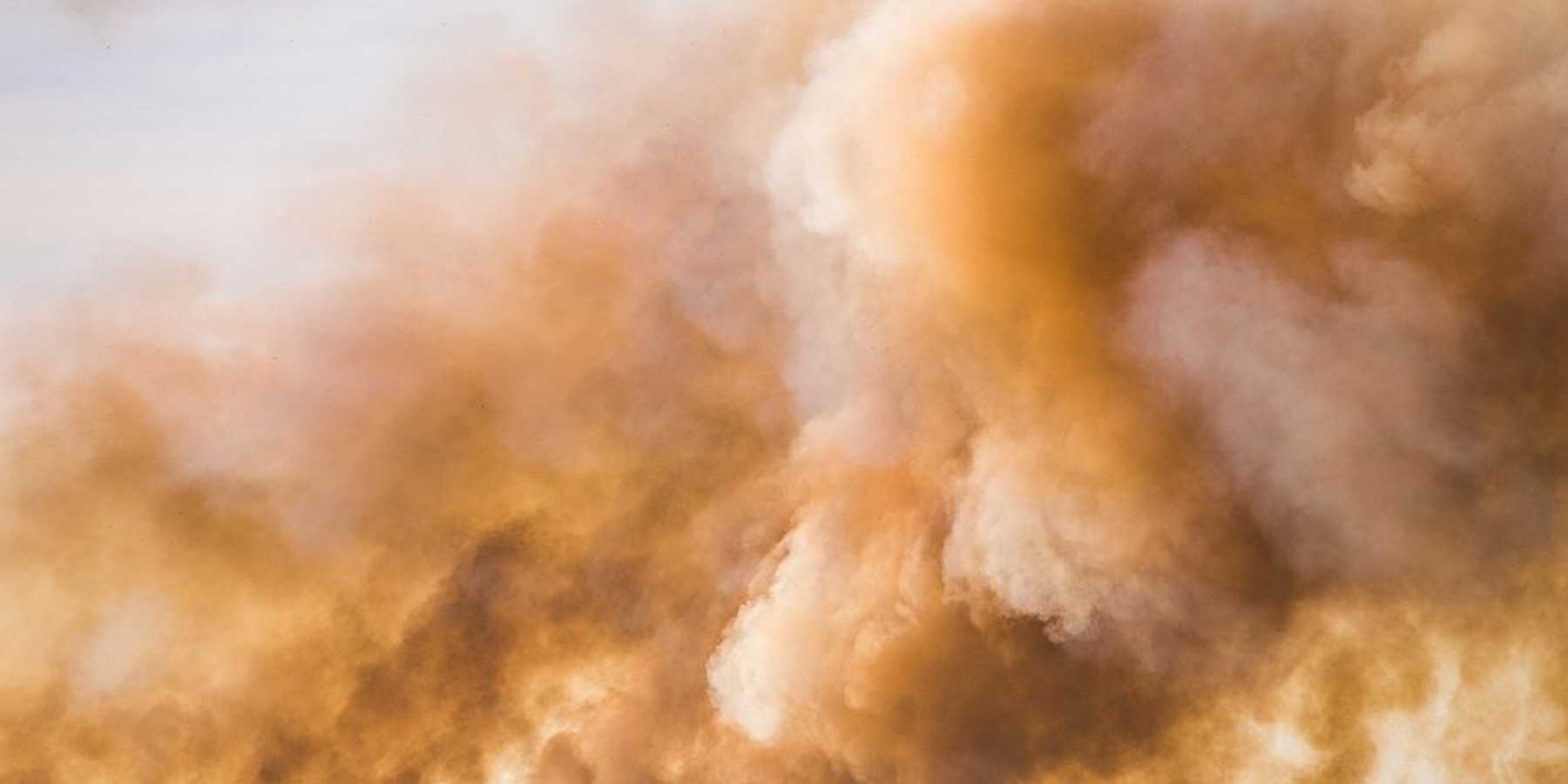 Clouds and smoke billowing into the sky.