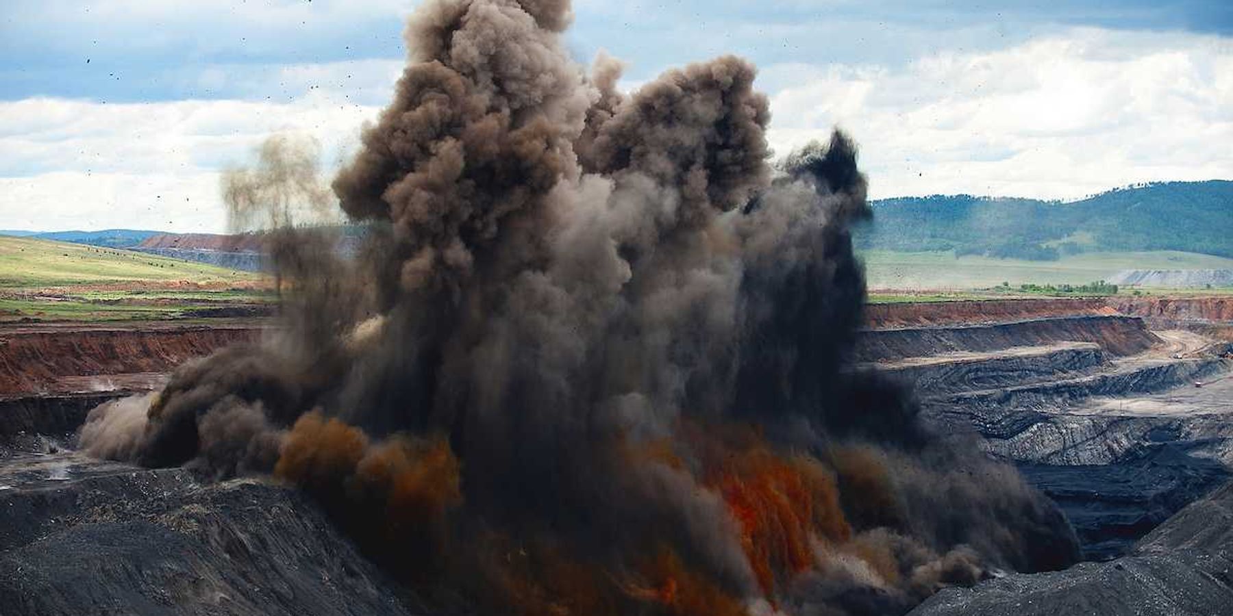 Coal mine blasting to remove overburden - explosion with dust cloud