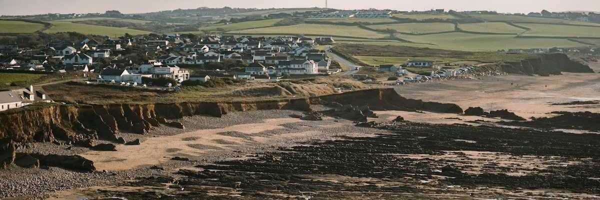 Coastal erosion threatening coastal UK like here at Widemouth Bay, Bude, UK