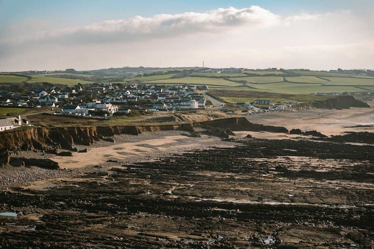 Coastal erosion threatening coastal UK like here at Widemouth Bay, Bude, UK