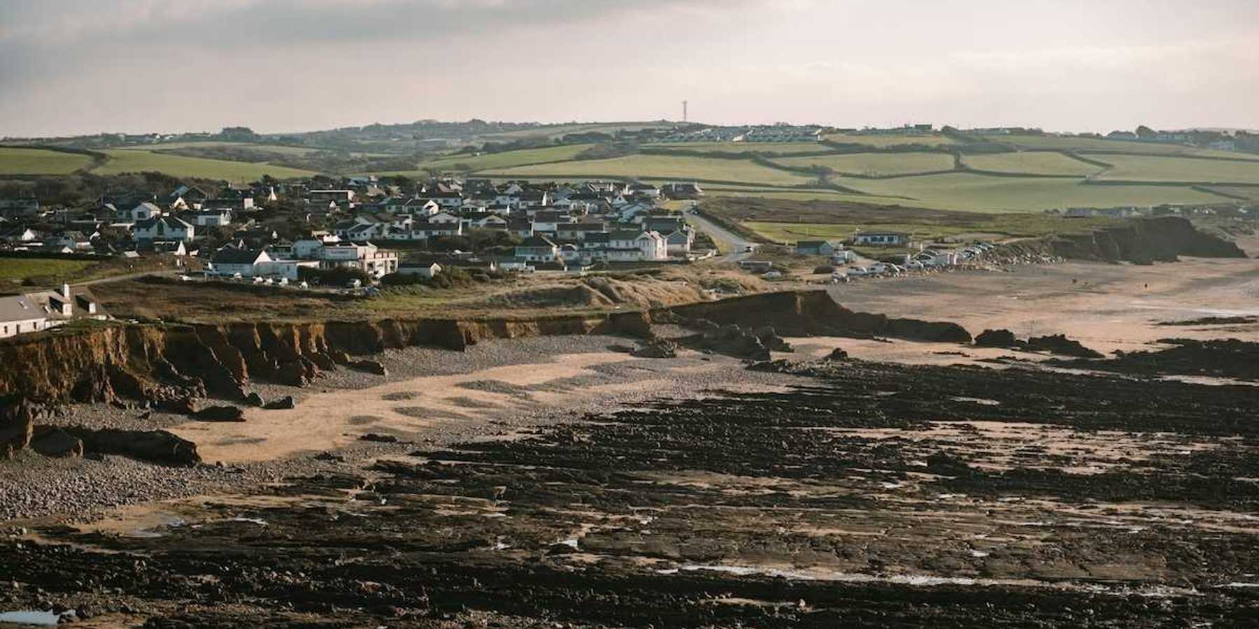 Coastal erosion threatening coastal UK like here at Widemouth Bay, Bude, UK