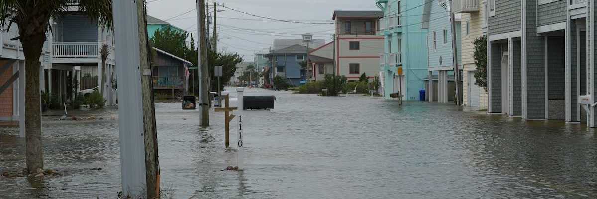Coastal street flooding on Carolina Beach, NC during king tide.