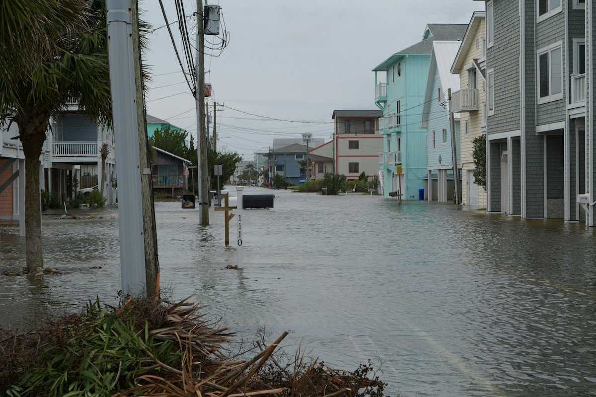 Coastal street flooding on Carolina Beach, NC during king tide.