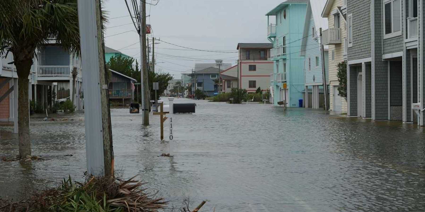 Coastal street flooding on Carolina Beach, NC during king tide.