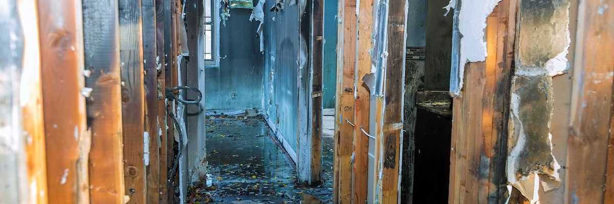 Completely burnt wooden house consequences of fire in California USA