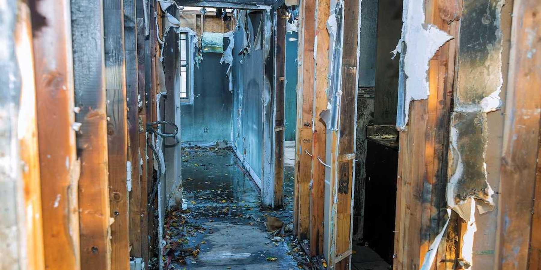 Completely burnt wooden house consequences of fire in California USA