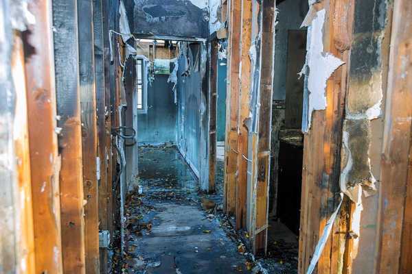 Completely burnt wooden house consequences of fire in California USA