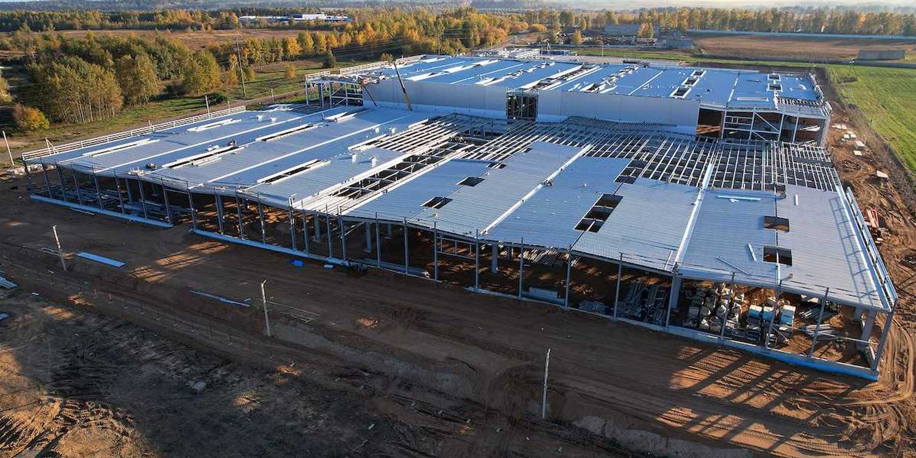 Construction site with steel structure warehouse.