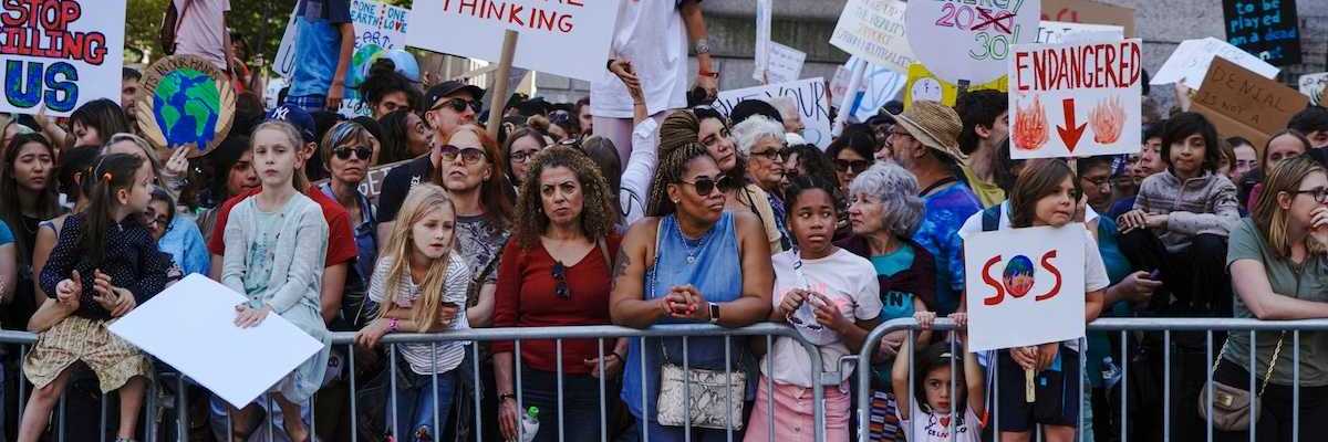 Crowd of mostly children and adults demonstrate displeasure over anti-science, anti-climate, policies.