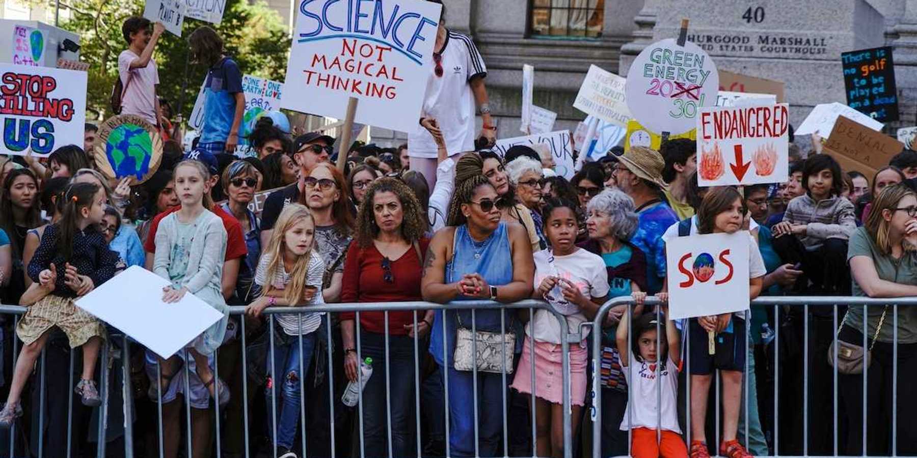 Crowd of mostly children and adults demonstrate displeasure over anti-science, anti-climate, policies.